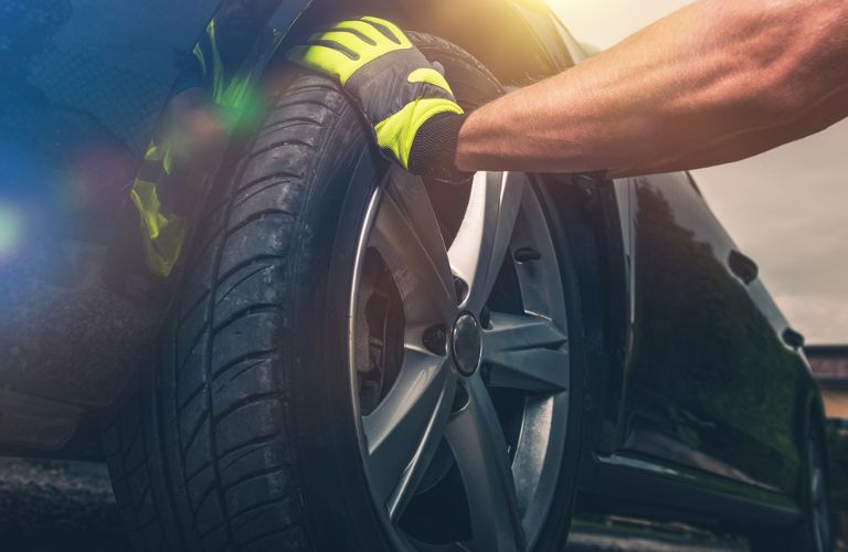 a technician repairing a tire